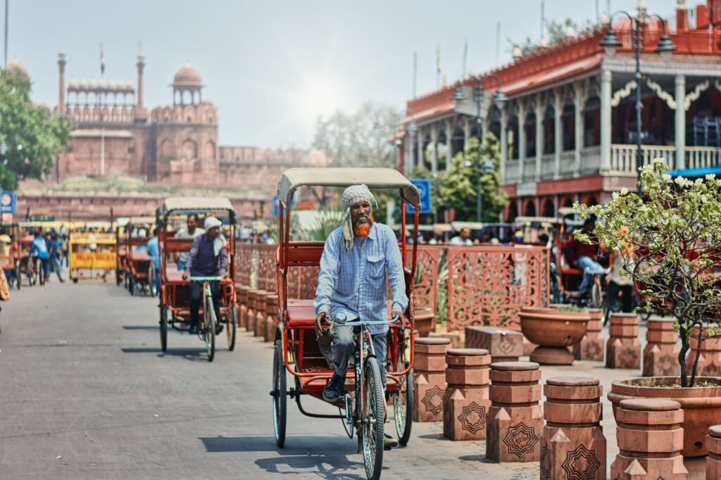 Tricycle Rickshaws Riding on a Street near Chandni Chowk Market, Dehli, India