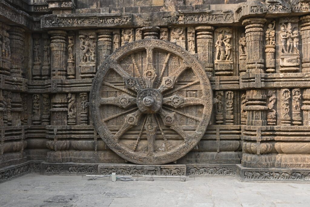 Wheel and Sculptures on the Wall of the Konark Sun Temple, Puri, Odisha, India